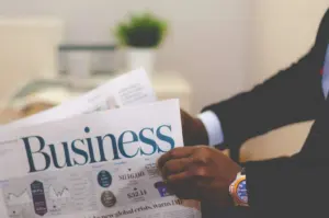 Business newspaper and coffee on a desk